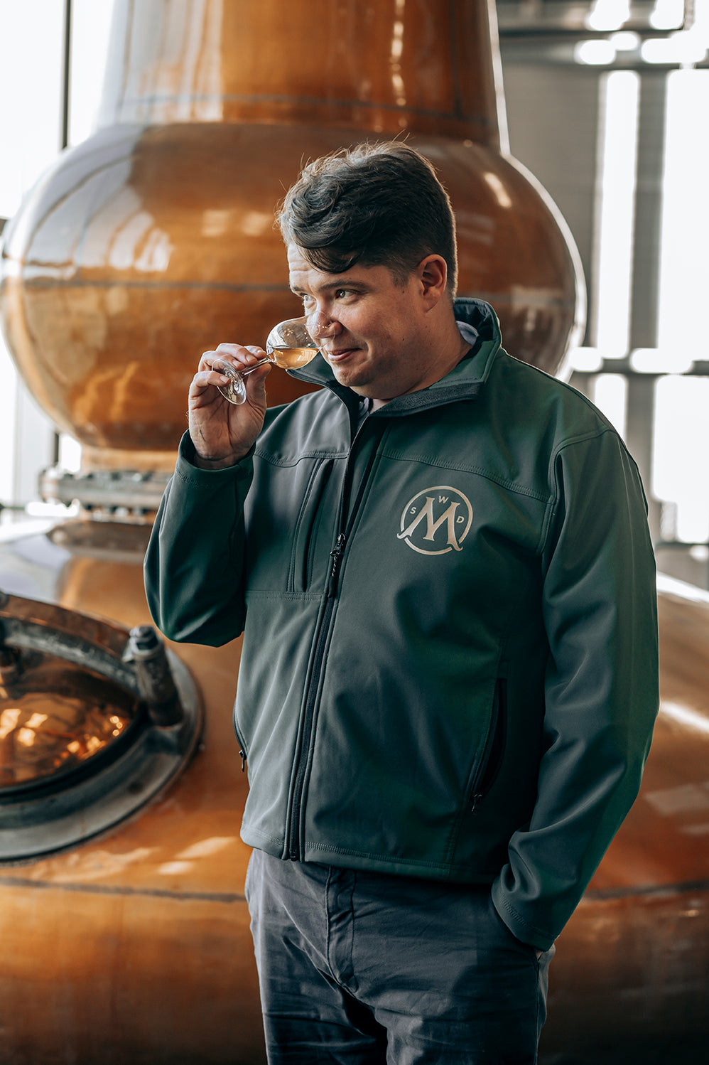 crew member from Aberargie with whisky drink in hand